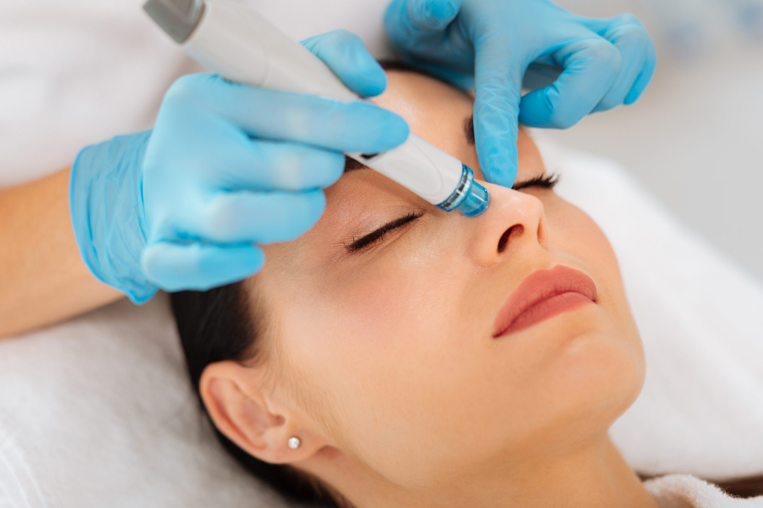 Client receiving HydraFacial treatment.